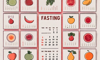 A calendar with symbolic menstrual cycle icons and fruits